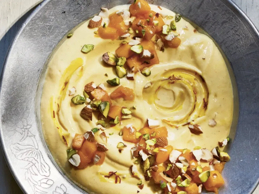 Golden mango cardamom yogurt topped with mango, pistachio and saffron